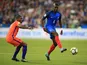 Paul Pogba is pursued by Georginio Wijnaldum during the World Cup qualifier between France and the Netherlands on August 31, 2017