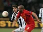 Liverpool's Jose Enrique and Udinese's Diego Fabbrini battle for the ball on December 6, 2012
