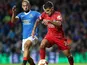 Olympique Lyonnais' Bruno Guimaraes in action with Rangers' Kemar Roofe, September 16. 2021