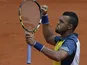 Jo-Wilfried Tsonga celebrates after defeating Jarkko Nieminen during their second round match of the French Open on May 29, 2013