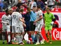 St Louis City SC defender John Nelson (14) is given a red card by referee Filip Dujic after receiving his second yellow card on May 13, 2023