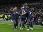 Paris Saint-Germain's (PSG) Kylian Mbappe celebrates scoring their first goal with teammates on March 9, 2022