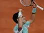 Novak Djokovic celebrates after defeating Grigor Dimitrov during their third round match of the French Open on June 1, 2013