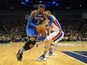 Carmelo Anthony of the New York Knicks gets away from Detroit Pistons player Kyle Singler on January 17, 2013