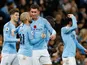 David Silva celebrates with his Manchester City teammates after giving his side the lead in the Manchester derby on November 11, 2018