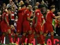 Jose Enrique celebrates with Liverpool teammates on November 17, 2012