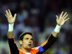 Sevilla's goalkeeper Andres Palop aknowledges applause after the Spanish league football match Sevilla FC Valencia at the Ramon Sanchez Pizjuan stadium in Sevilla, on June 1, 2013