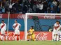 Peru's Carlos Zambrano and teammates look dejected after Uruguay's Giorgian de Arrascaeta scored their first goal on March 24, 2022