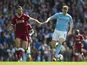 Jordan Henderson and Kevin De Bruyne in action during the Premier League game between Manchester City and Liverpool on September 9, 2017