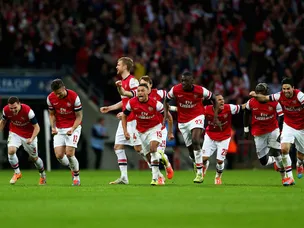 Arsenal beat Wigan on penalties