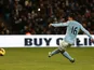 Man City striker Sergio Aguero scores a penalty against Stoke on January 1, 2013