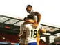 Warrington Wolves' Toby King celebrates with teammates after scoring their fourth try on May 25, 2019