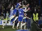 Brighton & Hove Albion's Adam Webster celebrates scoring their first goal with teammates and fans on January 18, 2022