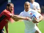 England player Dan Caprice fends off a challenge during his side's match with Spain on May 28, 2011