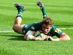 Leicester Tigers' Blaine Scully dives in to score a try against Newcastle Falcons during their Aviva Premiership match on September 21, 2013