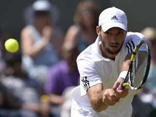 Troicki battles back to beat Lopez