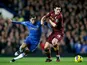 Gareth Barry holds back Eden Hazard as they battle for the ball on November 25, 2012