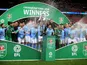 Manchester City players celebrate winning the EFL Cup on February 25, 2018