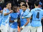 Manchester City players celebrate scoring against Salford City on February 14, 2026