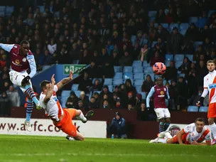 Late Benteke strike sends Villa through
