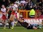 Catalan Dragons' Julian Bousquet tackles Hull KR's Craig Hall during a Super League match on February 3, 2013