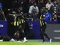 Al Ittihad's N'Golo Kante celebrates scoring their first goal with Marwan Al Sahaf and Zakaria Al Hawsawi on March 1, 2024