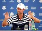 Webb Simpson gets hands-on during a Ryder Cup presser on September 26, 2018