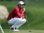 Rory McIlroy waits for his turn to putt on the first green during the third round of the Texas Open golf tournament on April 6, 2013