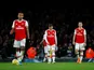 Arsenal's Mesut Ozil and Granit Xhaka look dejected after Brighton & Hove Albion's Neal Maupay scored their second goal on December 5, 2019