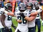 Seattle Seahawks tight end Jacob Hollister is congratulated by guard Ethan Pocic after scoring a touchdown against Washington on December 20, 2020