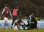 Aston Villa striker Darren Bent is treated for injury at Carrow Road on December 11, 2012