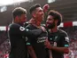 Liverpool's Roberto Firmino celebrates scoring their second goal with teammates Alex Oxlade-Chamberlain and Mohamed Salah on August 17, 2019