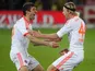 Anatoliy Tymoshchuk is congratulated by Thomas Mueller after scoring the second goal of the match against Freiburg on November 28, 2012