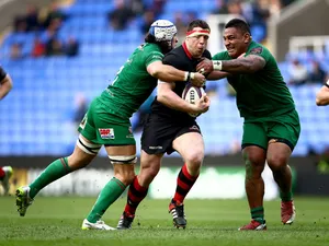 Alasdair Dickinson of Edinburgh is tackled by Blair Cowan and Halani Aulika of London Irish during the European Rugby Challenge Cup Quarter Final between London Irish and Edinburgh Rugby at the Madejski Stadium on April 5, 2015