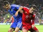 Bosnia-Herzegovina's Mensur Mujdza in action with Wales' Gareth Bale on October 10, 2014