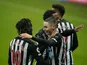 Newcastle United's Miguel Almiron celebrates scoring their third goal with teammate Allan Saint-Maximin on February 6, 2021