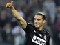 Juventus defender Martin Caceres gives a thumbs up after his side's Seria A match against Napoli on October 20, 2012