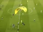 A Greenpeace protestor parachutes onto the pitch before France take on Germany at Euro 2020 on June 15, 2021