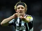 Anthony Gordon of Newcastle United celebrates scoring against Benfica in the Champions League, on October 21, 2025