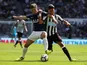 Ben Davies and Ayoze Perez in action during the Premier League game between Newcastle United and Tottenham Hotspur on August 13, 2017