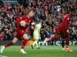 Jordan Henderson and Divock Origi after Liverpool score against Barcelona in the Champions League on May 7, 2019.