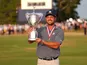 Bryson DeChambeau celebrates with the trophy after winning the U.S. Open golf tournament on June 16, 2024