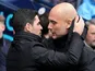 Manchester City manager Pep Guardiola and Arsenal manager Mikel Arteta speak in March 2024